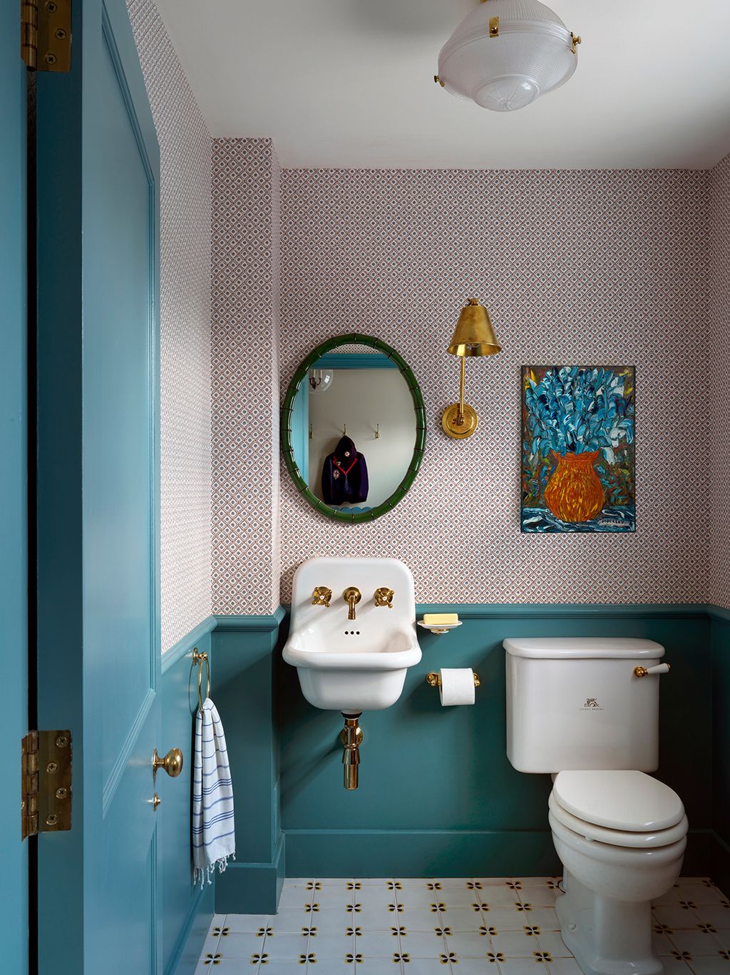 Panelling in a deep shade of blue livens up this boot room loo in a Georgian house revived by Salvesen Graham with...