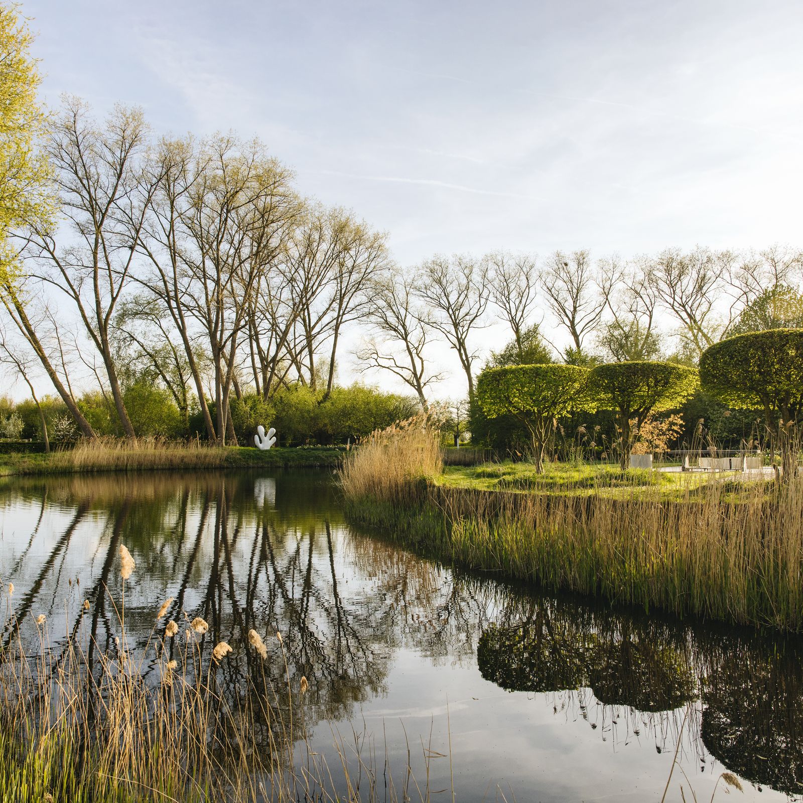 A fortified farmstead near Bruges whose free-flowing garden is shaped by art
