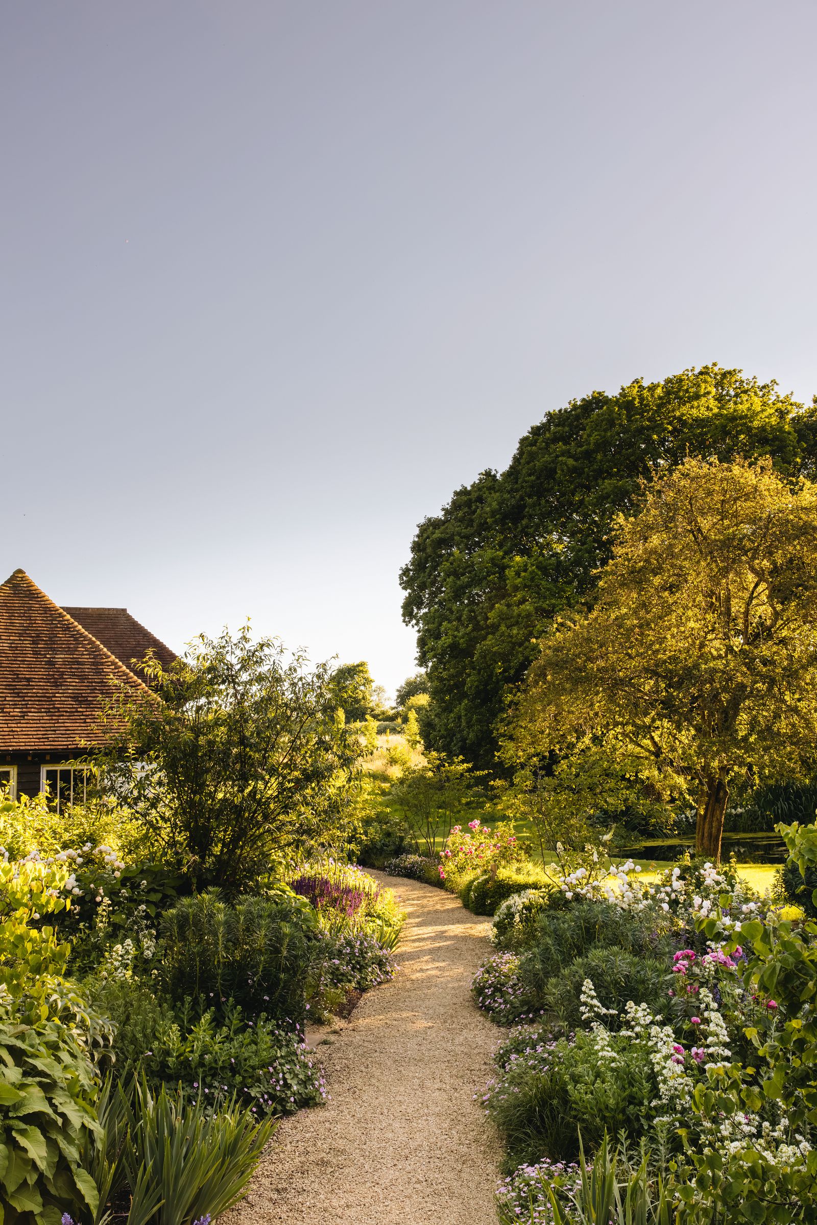 Image may contain Outdoors Nature Garden Countryside Architecture Building Housing Rural Village and Plant
