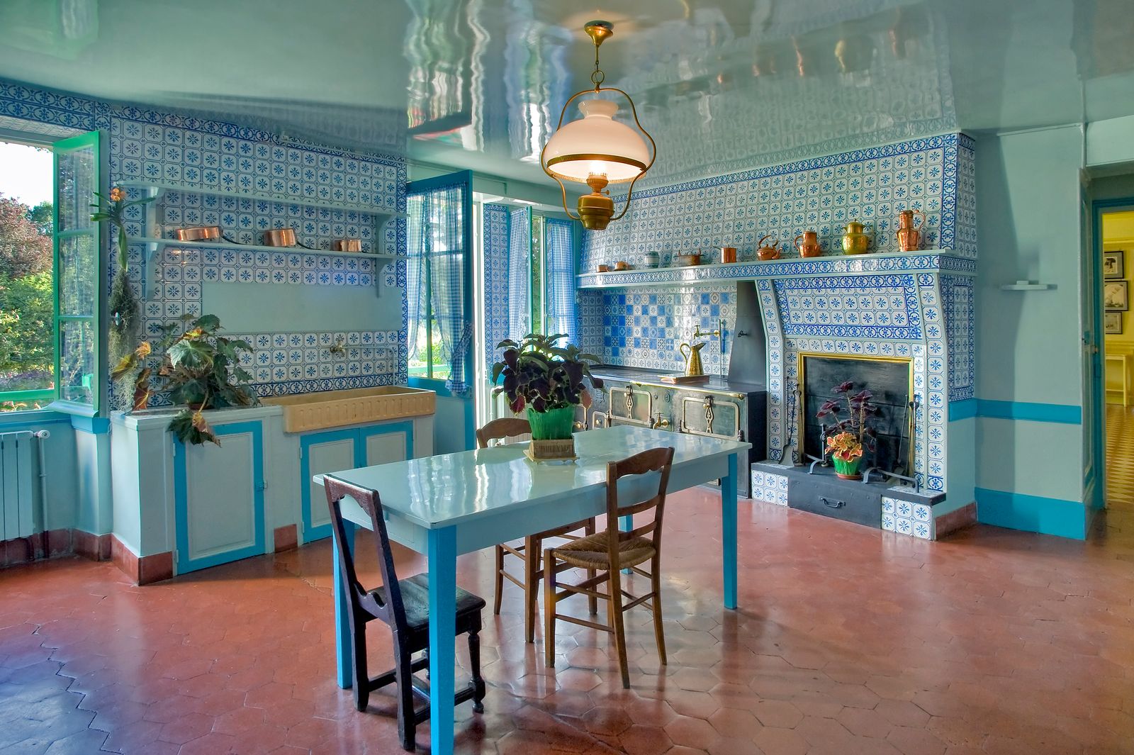 Image may contain Architecture Building Dining Room Dining Table Furniture Indoors Room Table Lamp Chair and Floor