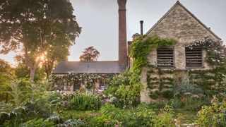 Image may contain Architecture Building Cottage House Housing Garden Nature Outdoors Yard Arch and Gothic Arch