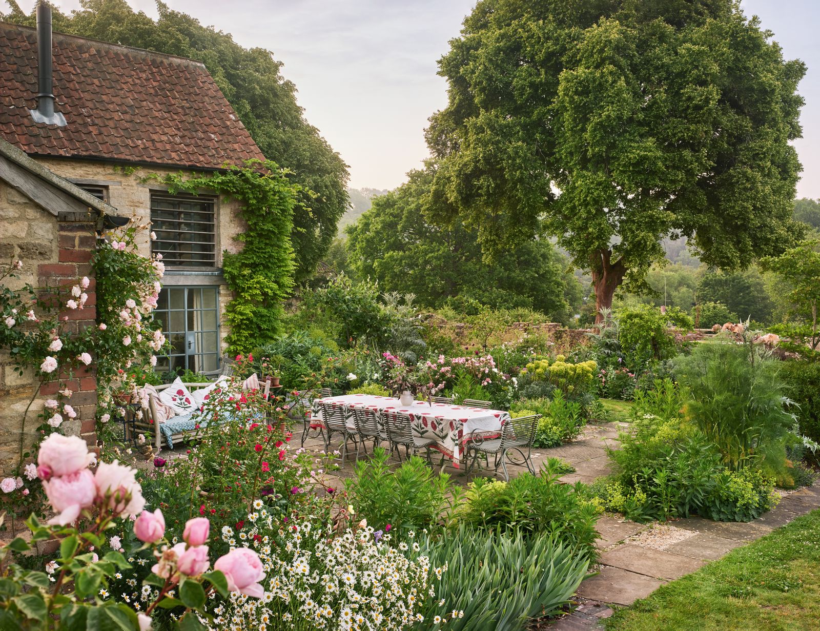 Image may contain Garden Nature Outdoors Architecture Building Cottage House Housing Backyard Yard and Grass