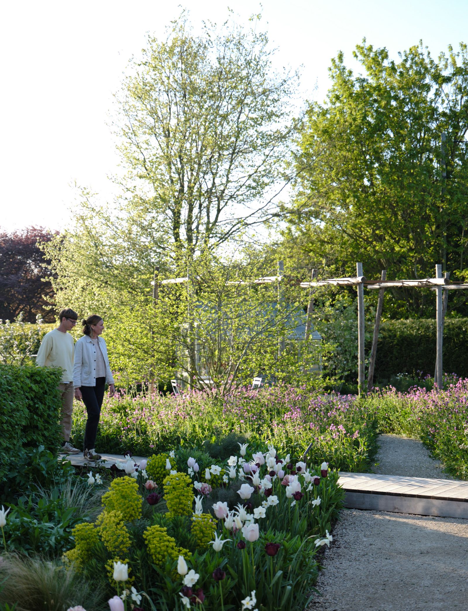 Image may contain Garden Nature Outdoors Grass Park Plant Vegetation Person Walking Potted Plant Jar and Planter
