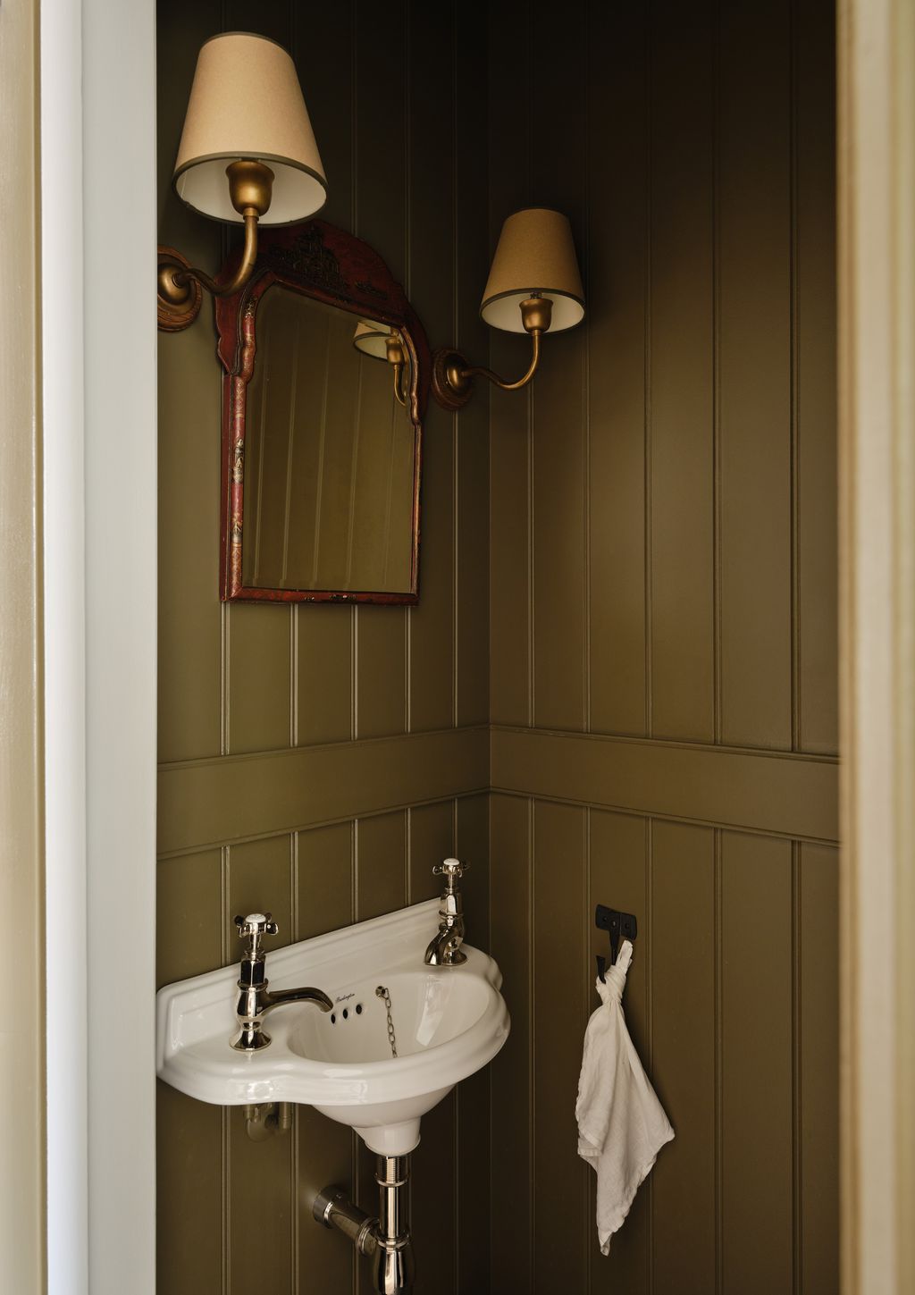 Echoing the front door and the huge amount of bespoke features throughout the home the downstairs loo in this...