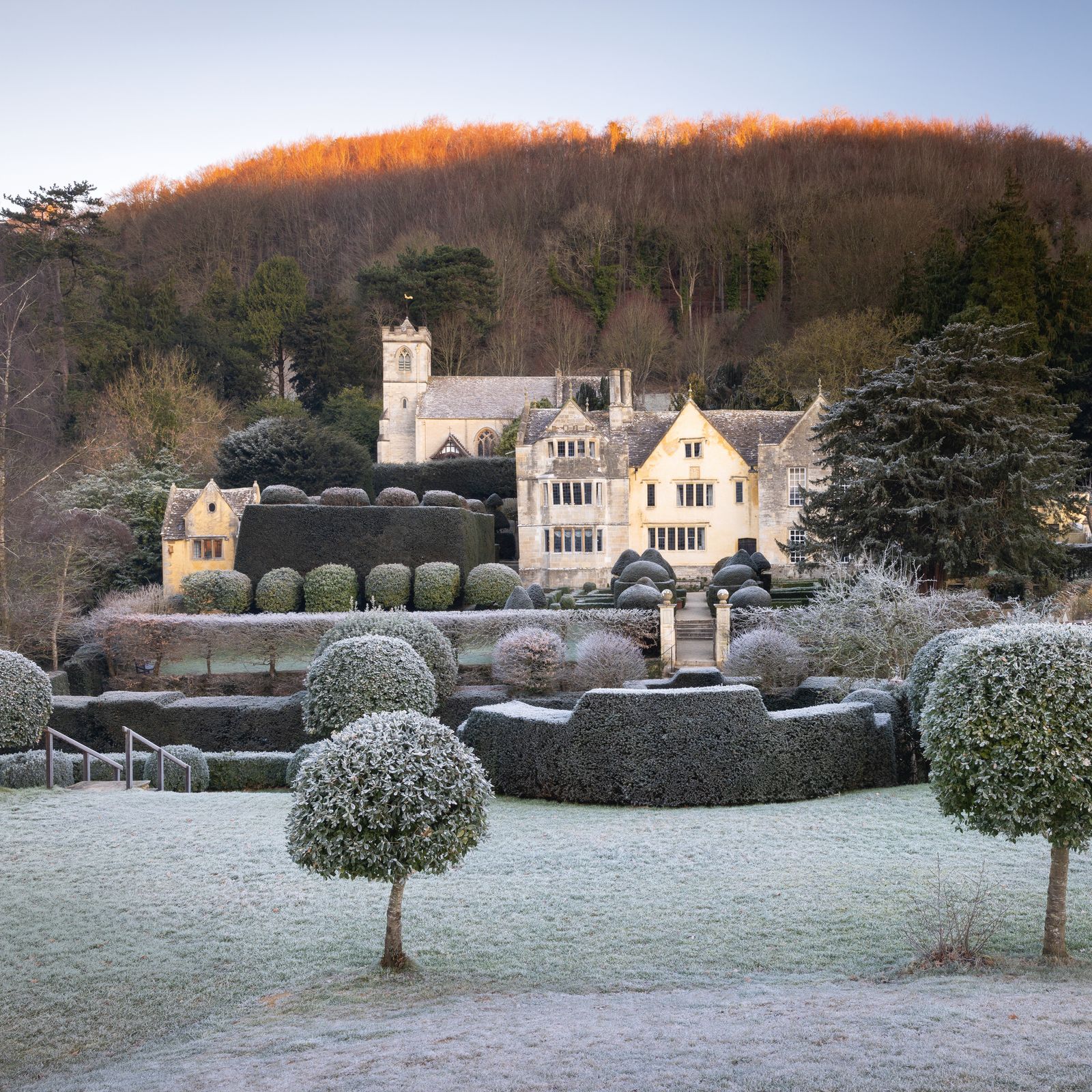 A centuries-old Cotswold garden hidden in a valley, with enchanting topiary
