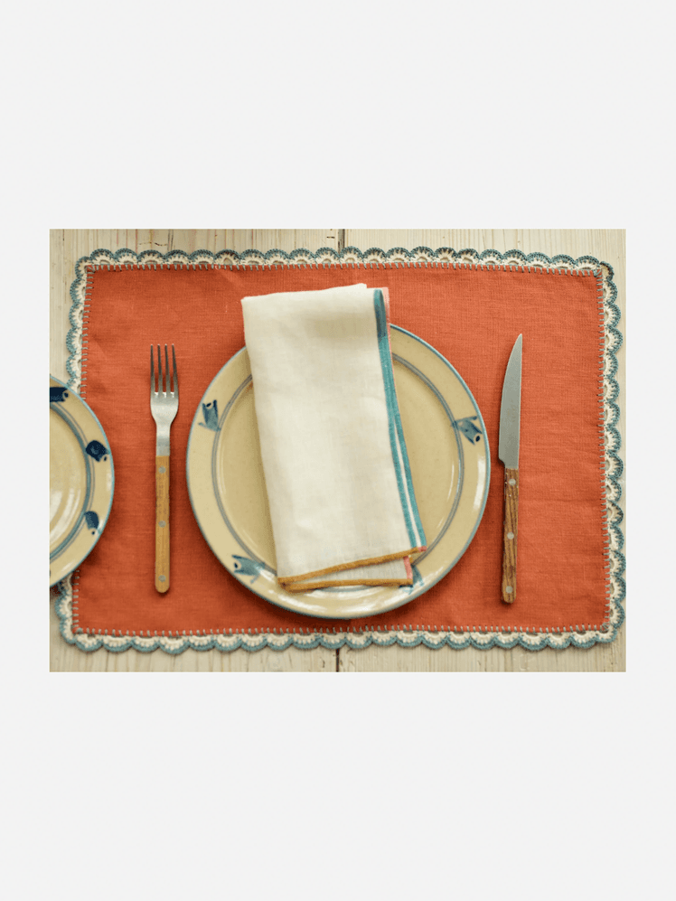 Image may contain Cutlery Fork Napkin Home Decor and Linen